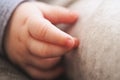 Infant baby boy hand close up, shallow depth of field photo only his finger in focus. Abstract motherhood background Royalty Free Stock Photo