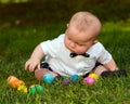 Infant baby boy playing with Easter eggs Royalty Free Stock Photo