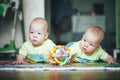 Infant Baby Child Twins Brothers Six Months Old is Playing on the Floor Royalty Free Stock Photo