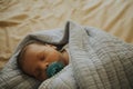 Infant baby fast asleep on the bed