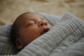 Infant baby fast asleep on the bed