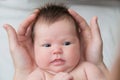 Infant baby in fathers hands, happy fatherhood Royalty Free Stock Photo