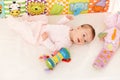 Infant with baby toys