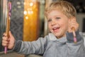 Infant boy smiling with chopsticks at restaurant Royalty Free Stock Photo