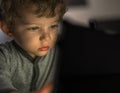 Infant boy watching an tablet Royalty Free Stock Photo