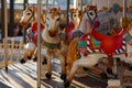 Infant carousel with workhorses outdoors