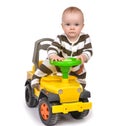 Infant child baby boy toddler happy driving big toy car truck Royalty Free Stock Photo