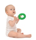 Infant child baby boy toddler playing holding green circle