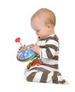 Infant child baby boy toddler playing with whirligig toy