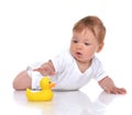 Infant child baby boy toddler playing with yellow duck toy in ha Royalty Free Stock Photo