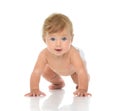 Infant child baby girl in diaper crawling happy looking at the c Royalty Free Stock Photo