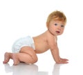 Infant child baby girl in diaper crawling happy looking at the c Royalty Free Stock Photo