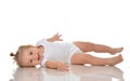 Infant child baby girl in diaper lying on a back happy smiling Royalty Free Stock Photo