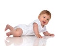 Infant child baby girl in diaper lying happy smiling looking at Royalty Free Stock Photo