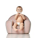 Infant child baby girl kid toddler in diaper sit in little armchair chair Royalty Free Stock Photo