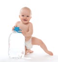 Infant child baby girl sitting with big bottle of drinking water