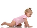 Infant child baby girl toddler crawling happy looking straight Royalty Free Stock Photo