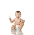 Infant child baby girl toddler playing with mobile cellphone happy smiling Royalty Free Stock Photo