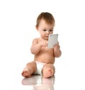 Infant child baby girl toddler playing with mobile cellphone happy smiling Royalty Free Stock Photo