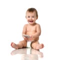 Infant child baby girl toddler playing with mobile cellphone happy smiling Royalty Free Stock Photo