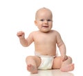 Infant child baby girl toddler sitting in diaper looking a