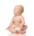 Infant child baby girl toddler sitting and looking at the corner Royalty Free Stock Photo