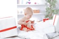 Infant child baby toddler kid sitting in presents gift for celebration Royalty Free Stock Photo