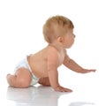 Infant child baby toddler sitting or crawling looking at the cor Royalty Free Stock Photo