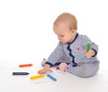 Infant child baby toddler sitting drawing painting with color pe Royalty Free Stock Photo