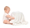 Infant child baby toddler sitting and open soft blanket towel