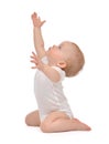 Infant child baby toddler sitting raise hands up Royalty Free Stock Photo