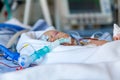 Infant, child in intensive care unit after heart surgery.