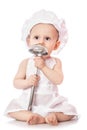 Infant cook baby portrait wearing apron and chef hat with metal ladle, isolated on a white background. Use it for child, healthy