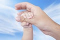 Infant hand holds father finger Royalty Free Stock Photo