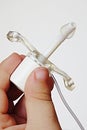 Infant neonatal tracheostomy cannula tube with inflated cuff held in child hand