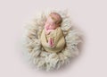 Infant sleeping swaddled with rabbit toy, topview Royalty Free Stock Photo