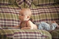 Infant wear jeans and suspenders at home Royalty Free Stock Photo