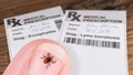 Castor bean tick and medical prescription with bar code. Ixodes ricinus