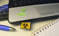Infecting a laptop with a Computer Virus via a memory card, computer virus attack,hacking,malware,computer crime concept
