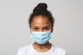 Portrait of little black girl wearing medical mask Royalty Free Stock Photo