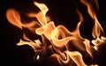 Inferno\'s Embrace: Flames Dancing in a Dark Room Royalty Free Stock Photo