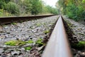 Infinite abandoned steel rail track without train Royalty Free Stock Photo