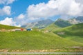 Infinite Horizons: Majestic Green Mountains Meet Blue Skies