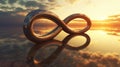 Infinite loop sculpture at sunset on water Royalty Free Stock Photo