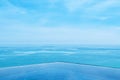 Infinity edge pool with blue sea and clear sky. Wide angle shot Royalty Free Stock Photo