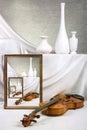 Infinity, endless violin framed on a table with white vases