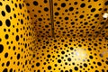 An infinity mirror room full with yellow and black polka dots pumpkins installation art by Japanese artist Kusama Yayoi.