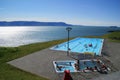 Infinity outdoor pool overlooking fjord mountains in Hofsos in northern Iceland