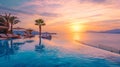 Infinity pool with cabanas overlooking sunset