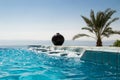 Infinity pool jacuzzi, azure water. Luxury lifestyle, tropical resort concept. Royalty Free Stock Photo